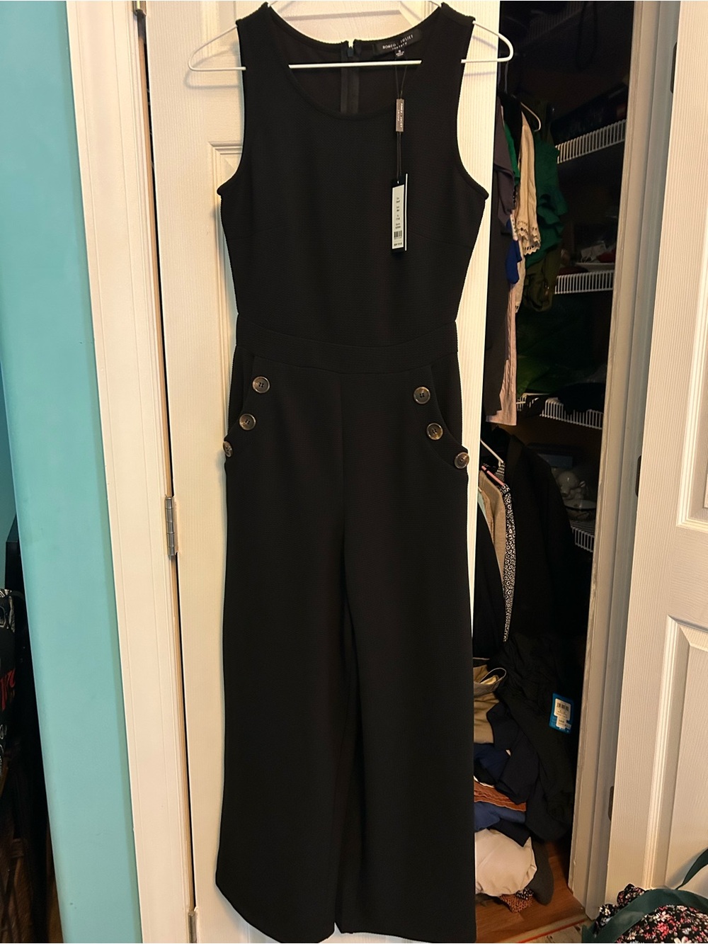 Romeo & Juliet Couture Black Sleeveless Wide-Leg Jumpsuit with Button Accents